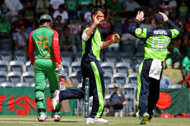 Max Sorensen is congratulated by William Porterfield after he dismissed Shakib Al Hasan
