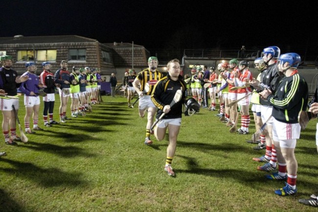 Cork players perform a guard of honour for the Kilkenny team before the game