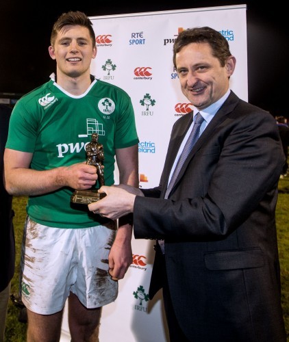 Ross Byrne receives the man of the match award from Jim Dollard