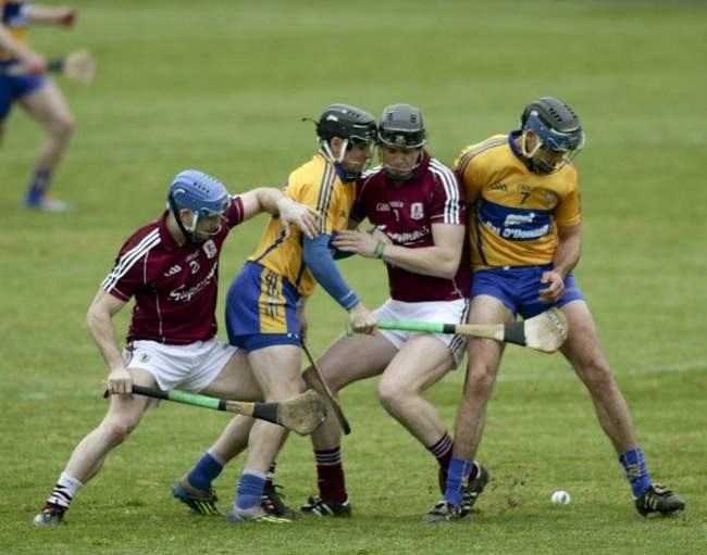 Andy Smith and Joseph Cooney clash with Cloin Ryan and Clom Gavin at the throw in