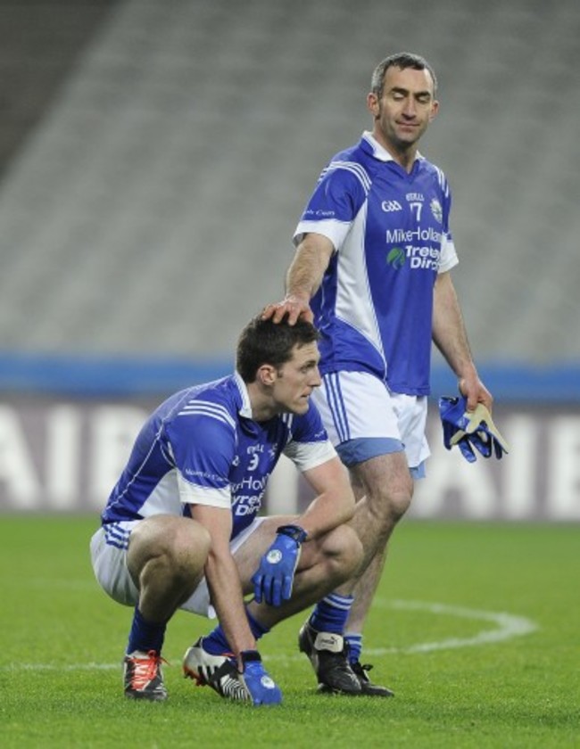 Brian Mullin is consoled by teammate Martin Towey at the end of the game