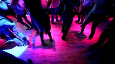 stock-footage-legs-of-many-dancing-men-and-women-in-some-nightclub-with-different-colors-blinking