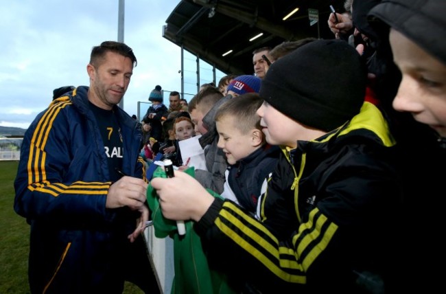 Robbie Keane signs autographs for fans