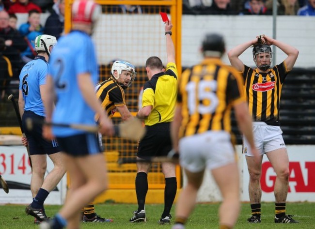 Colm Lyons shows Jonjo Farrell a red card