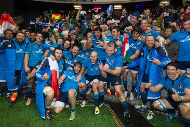 Italy players celebrate with their supporters