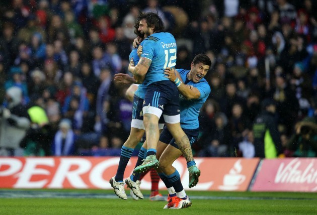 Italy players celebrate after scoring a try