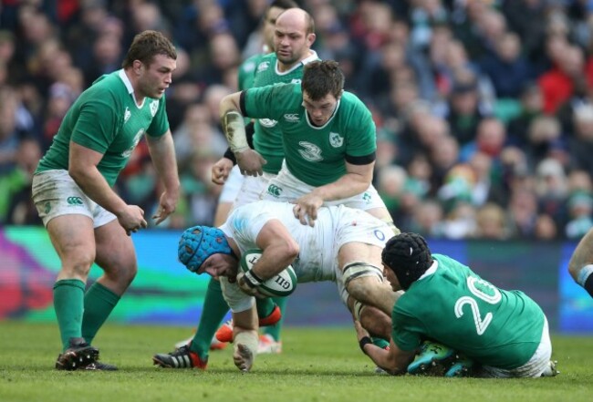England&Otilde;s James Haskell is tackled by Ireland&Otilde;s Jack McGrath Peter O'Mahony and Tommy O&Otilde;Donnell 1/3/2015