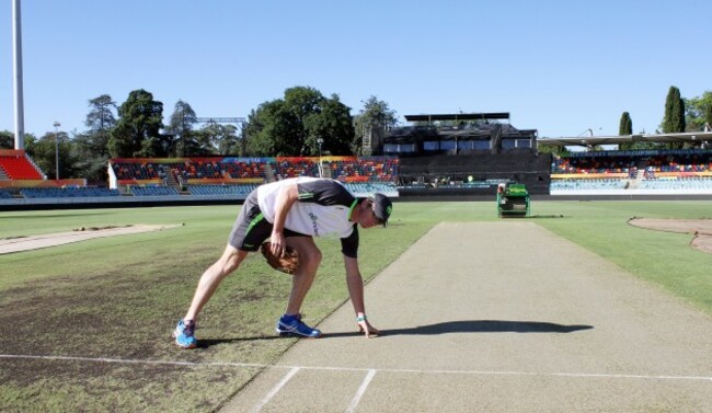 Peter Johnston inspects the pitch