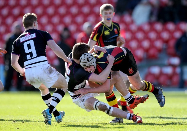 Peadar Collins tackled by Peter Sylvester