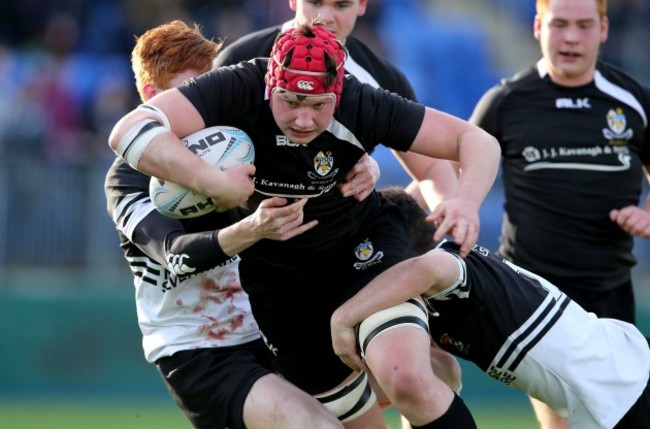 Fineen Wycherley tackled by Brian Larkin and Robert Buckley