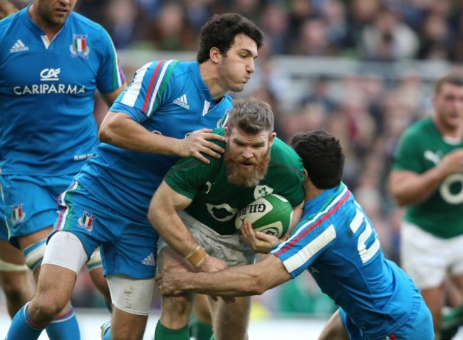 Gordon D'Arcy is tackled by Leonardo Sarto