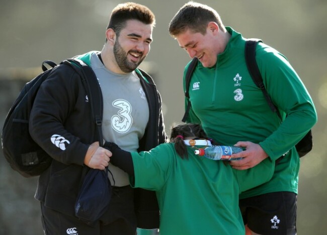 Jennifer Malone hugs Marty Moore and Tadhg Furlong before training