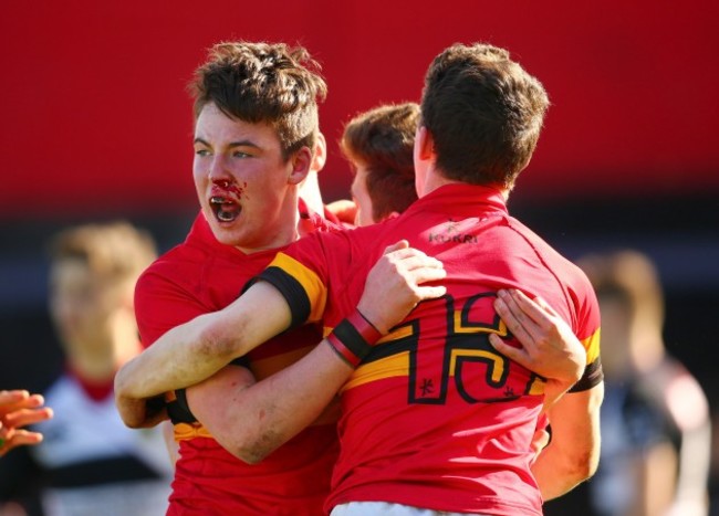 Daniel O'Connor celebrates with Eoin Monahan and JD O'Hea