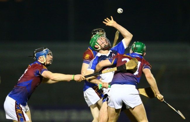 Gavin O'Beien under pressure from David McInerney and Cathal McInerney