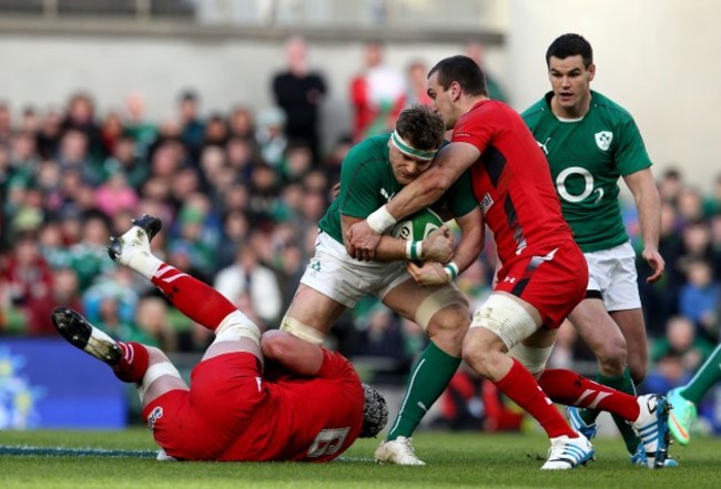 Jamie Heaslip tackled by Sam Warburton and Dan Lydiate