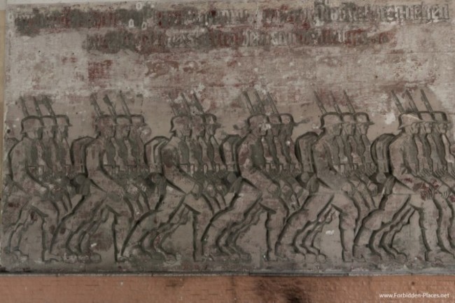 in-the-amphitheater-a-base-relief-sculpture-by-german-artist-walter-von-ruckteschell-depicts-german-troops-marching
