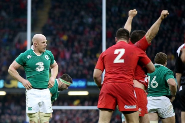 Paul O'Connell dejected at the final whistle as Wales players celebrate