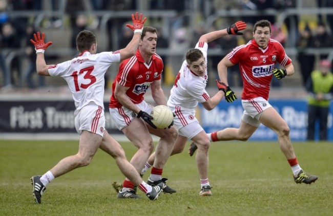 Fintan Goold tackled by Dwayne Quinn and Darren McCurry