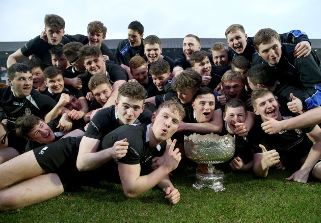 The Roscrea players celebrate with the cup