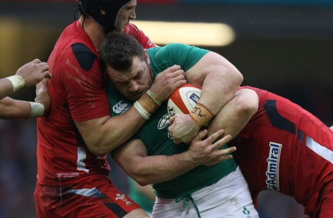 Ireland&Otilde;s   Cian Healy is tackled by Wales Luke Charteris