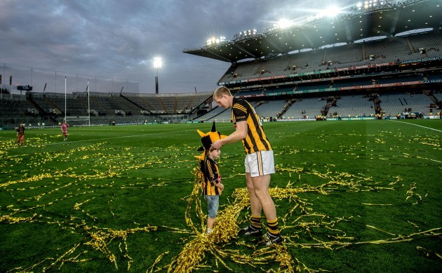 KilkennyÕs Henry Shefflin places a hat on his sons Henry's head after the game