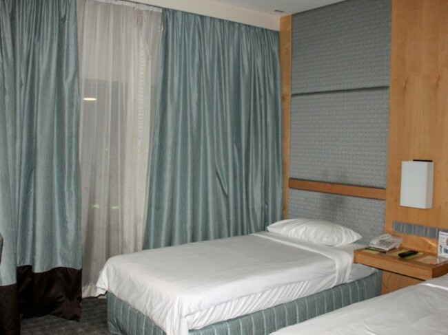 rooms-here-look-like-normal-hotel-rooms-with-two-twin-beds-or-one-double-bed-bathrooms-tvs-and-desks-some-rooms-have-windows-that-look-out-onto-the-tarmac