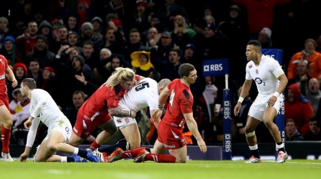 George North falls to the ground injured following a collision with Mike Brown