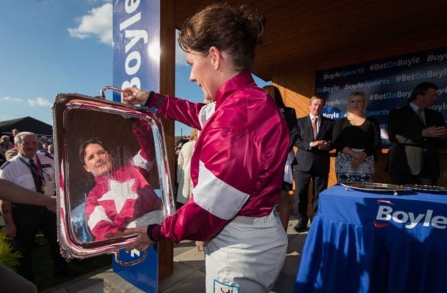 Katie Walsh in the parade ring after winning with An Taoiseach Enda Kenny