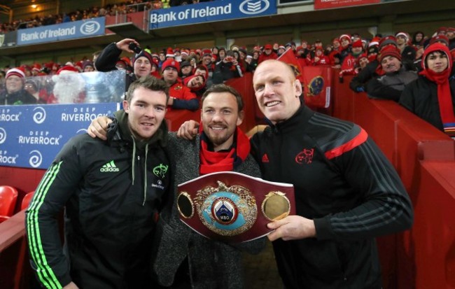 Andy Lee shows his belt off to the Munster fans at Halftime with Peter O'Mahony and Paul O'Connell