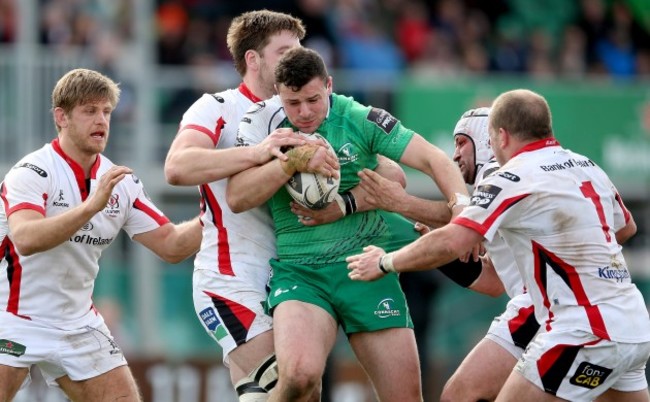 Iain Henderson, Rory Best and Callum Black tackle Robbie Henshaw