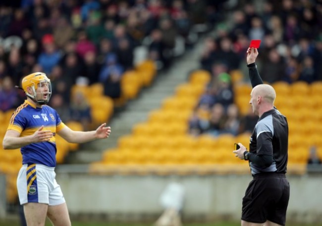 John Keenan shows a red a card to Seamus Callanan