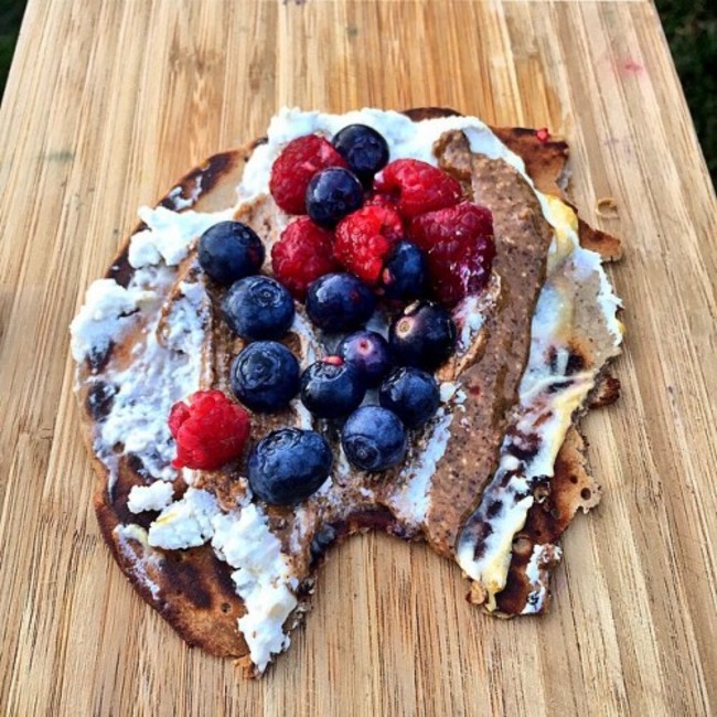 Devine evening treat buckwheat pancake smeared with coconut yogurt, almond butter and berries!