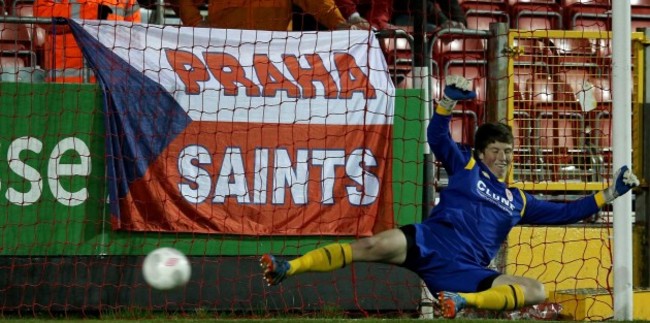 Goalkeeper Conor O'Malley is beaten by the penalty Lee Duffy