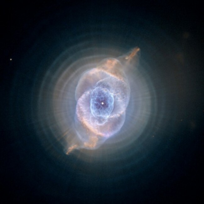 the-star-at-the-center-of-this-hubble-image-of-the-cats-eye-nebula-is-called-a-red-giant-star-which-is-what-our-sun-will-eventually-become-after-it-runs-out-of-hydrogen-to-burn-as-the-star-cools-a