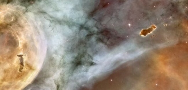 unlike-in-the-previous-hubble-image-the-evaporating-gaseous-globule-on-the-right-of-this-one-has-completely-detached-from-its-host-gas-cloud-this-is-a-close-up-image-of-the-carina-nebula-and-that-