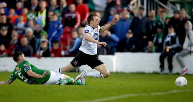 David McMillan is brought down for a penalty by Darren Dennehy