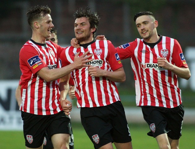 Philip Lowry celebrates scoring with Seanan Clucas and Dean Jarvis