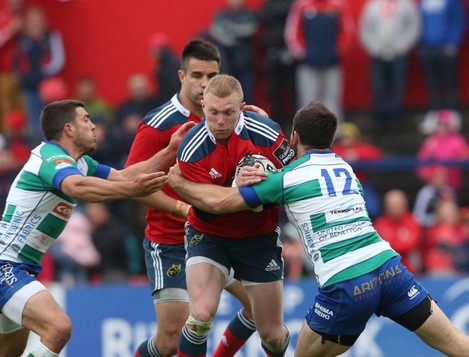 Keith Earls is tackled by Edoardo Gori and Enrico Bacchin