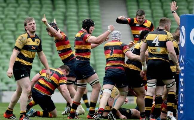 Lansdowne players celebrate scoring a try in the last seconds of extra time