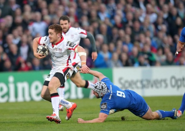 Paddy Jackson is tackled by Isaac Boss