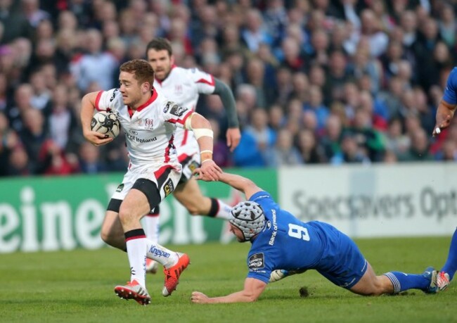 Paddy Jackson is tackled by Isaac Boss