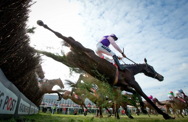 A general view of the runners and riders as they clear a fence