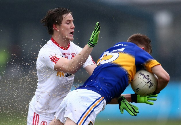 Paul Maher is tackled by Kieran McGeary