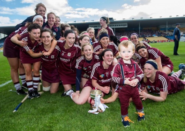 The Galway team celebrate as Tony Ward and grandson Oisin Helebert