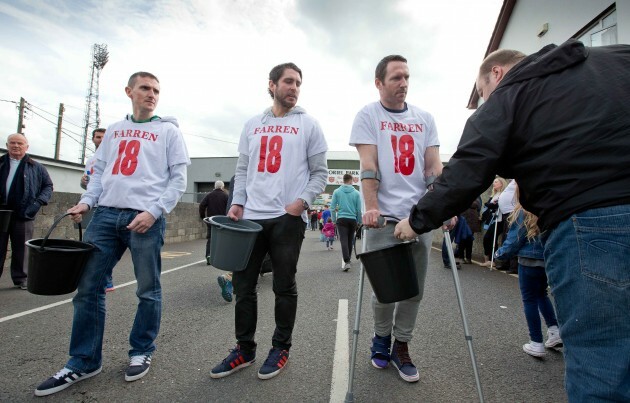 Collectors raise money in aid of Mark Farran outside the game before kick off