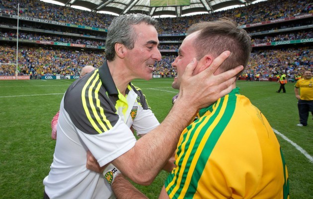 Jim McGuinness celebrates the final whistle with Karl Lacey