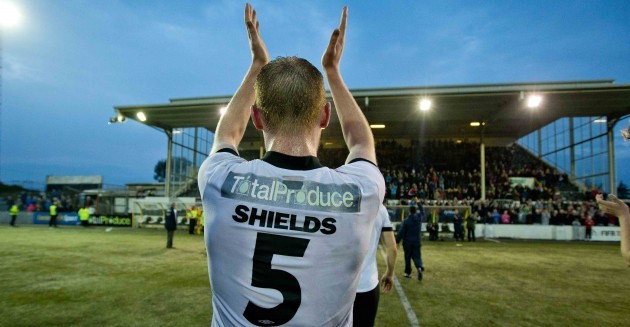 Chris Shields is applauded off the pitch