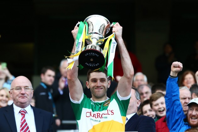 Paul McConway lifts the cup