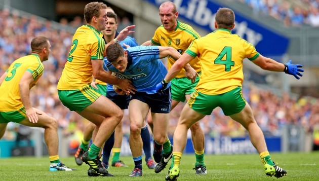 Eamonn McGee, Neil Gallagher and Paddy McGrath tackle Diarmuid Connolly