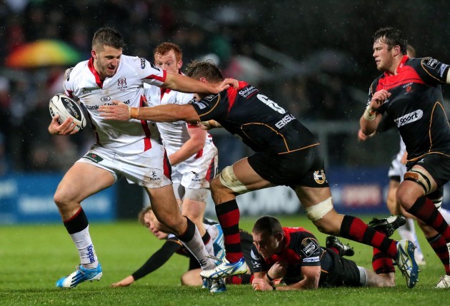Stuart McCloskey is tackled by Lewis Evans